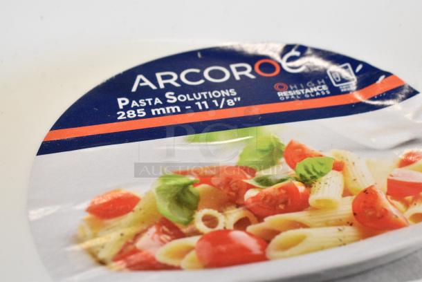 BRAND NEW SCRATCH AND DENT! Box of 12 Arcoroc N9405 Evolutions 11" White Round Opal Glass Pasta Plate by Arc Cardinal. - Image 4 of 6