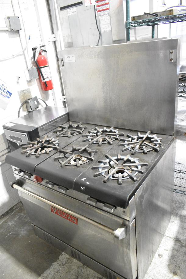 Vulcan 36L77R Stainless Steel Commercial Propane Gas Powered 6 Burner Range w/ Oven and Back Splash. - Image 1 of 7