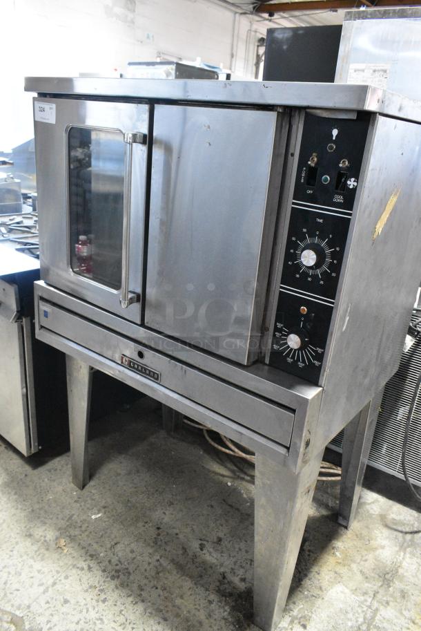 Garland TG3 Stainless Steel Commercial Natural Gas Powered Full Size Convection Oven w/ View Through Door, Solid Door, Thermostatic Controls and Metal Legs. 80,000 BTU. - Image 1 of 8