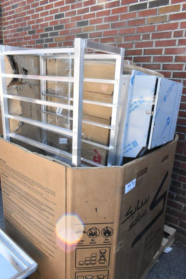 7 BRAND NEW SCRATCH AND DENT! Items Including 600ES3024G Regency 30" x 24" 16-Gauge Stainless Steel Equipment Stand with Galvanized Undershelf, 600T2448G Regency 24" x 48" 18-Gauge 304 Stainless Steel Commercial Work Table with Galvanized Legs and Undershelf, 600TSB3060S Regency 30" x 60" 16-Gauge Stainless Steel Commercial Work Table with 4" Backsplash and Undershelf, 600TSSB3660S Regency Spec Line 36" x 60" 14 Gauge Stainless Steel Commercial Work Table with 4" Backsplash and Undershelf. 7 Times Your Bid! May Be Missing Pieces. - Image 1 of 8
