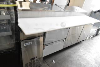 BRAND NEW SCRATCH AND DENT! 2024 Avantco 178SSPPT3 Stainless Steel 93" 2 Door Refrigerated Pizza Prep Table with 2 Drawers on  Commercial Casters. 115 Volts, 1 Phase.