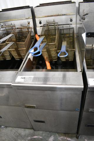 Pitco Frialator SG14 Stainless Steel Commercial Floor Style Natural Gas Powered Deep Fat Fryer w/ Side Splash Guard and 3 Metal Fry Baskets on Commercial Casters. 110,000 BTU.