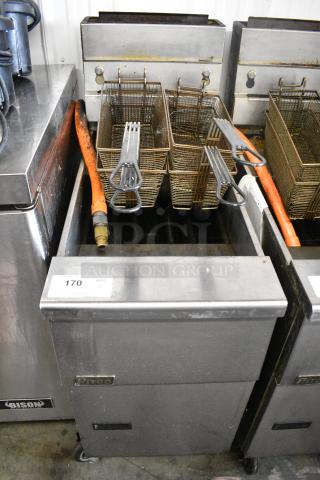 Pitco Frialator SG14 Stainless Steel Commercial Floor Style Natural Gas Powered Deep Fat Fryer w/ 4 Metal Fry Baskets on Commercial Casters. 110,000 BTU.