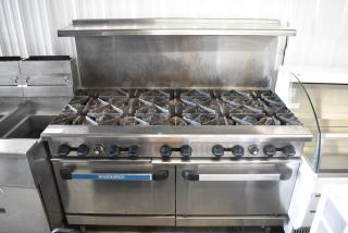 Radiance Stainless Steel Commercial Natural Gas Powered 10 Burner Range w/ 2 Ovens, Over Shelf and Back Splash on Commercial Casters.