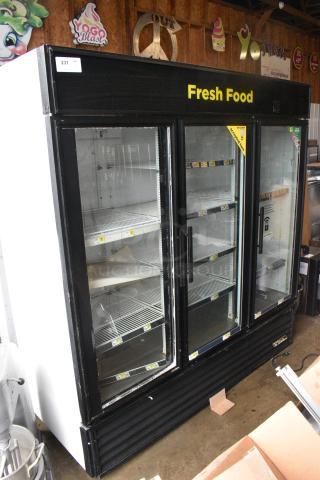 True GDM-72 Metal Commercial 3 Door Reach In Cooler Merchandiser w/ Poly Coated Racks. See Pictures for Broken Outer Glass Pane. 115 Volts, 1 Phase. Tested and Working!