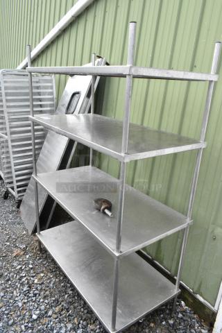 Metal 4 Tier Shelving Unit on Commercial Casters. 1 Caster Needs to Be Reattached. BUYER MUST DISMANTLE. PCI CANNOT DISMANTLE FOR SHIPPING. PLEASE CONSIDER FREIGHT CHARGES.