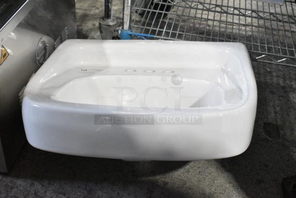 BRAND NEW SCRATCH AND DENT! Zurn Z5844 Ceramic Single Bay Wall Mount Sink. - Image 2 of 6
