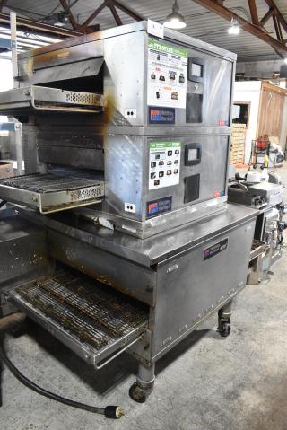 3 Middleby Marshall Stainless Steel Commercial Conveyor Pizza Ovens on Commercial Casters. Includes Models DZ33T. 208 Volts, 3/1 Phase. 3 Times Your Bid! - Item #1181681