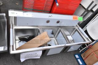 BRAND NEW SCRATCH AND DENT! Regency 600S31515 54" 16-Gauge Stainless Steel Three Compartment Commercial Sink with Galvanized Steel Legs and without Drainboards - 15" x 15" x 12" Bowls. No Legs.