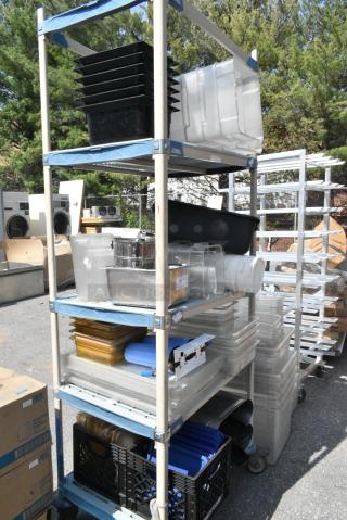 ALL ONE MONEY! Various Items Including Poly Bins, 2 Stainless Beverage Holder Dispensers, Blue Poly Lids. Does Not Include Shelving Unit