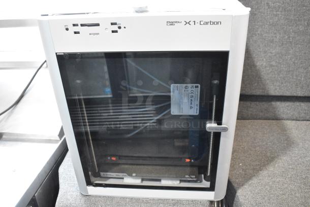 BRAND NEW SCRATCH AND DENT! 2024 Bambu PF001-P+SA001 X1 Combo 3D Printer. - Image 1 of 10