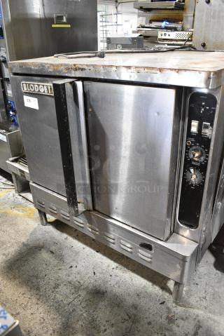 Blodgett Stainless Steel Commercial Full Size Convection Oven w/ Solid Doors, Metal Oven Racks and Thermostatic Controls.