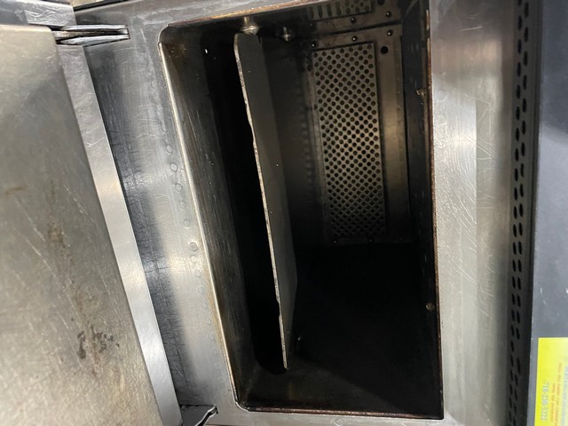 Clean interior cavity of rapid-cook oven showing heating elements