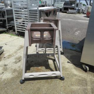 One Rubbermaid Hi Chair On Casters.
