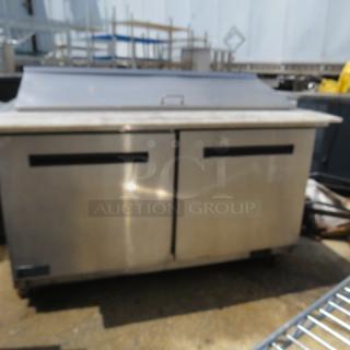 One WORKING 2 Door SS Artic Air Refrigerated Prep Table With 2 Racks And Cutting Board On Casters. 115 Volt. Model# AMT60R. 61X36X45