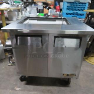 One WORKING True 2 Door Refrigerated Prep Table On Casters. NO LID. Model# TSSU-36-12M-B. 115 Volt. 36.5X34X38