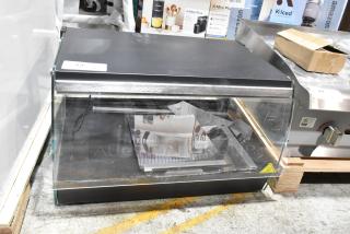 BRAND NEW SCRATCH AND DENT! Avantco 177OAM1A 26" Black Countertop Merchandiser with LED Lighting and 1 Shelf . 120 Volts, 1 Phase.