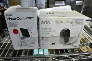 2 Various IN ORIGINAL BOX Items Including Wyze Cam Pan Camera and Arlo Essential Spotlight Camera. 2 Times Your Bid!