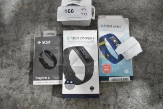 4 Various IN ORIGINAL BOX Items Including Fitbit Charge 4, Fitbit Inspire 2, Fitbit Ace 2, Samsung Watch. 4 Times Your Bid!