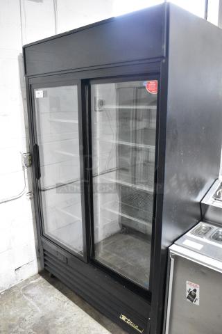 True GDM-45EM-LD Metal Commercial 2 Door Reach In Cooler Merchandiser w/ Poly Coated Racks on Commercial Casters. 115 Volts, 1 Phase. Tested and Powers On But Does Not Get Cold