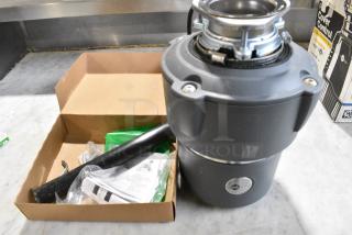 Insinkerator Pro Cover Control Garbage Disposal.