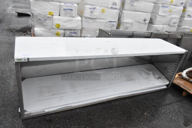 BRAND NEW SCRATCH AND DENT! Regency 600EBT2496 24" x 96" 16 Gauge Type 304 Stainless Steel Enclosed Base Table with Open Front and Adjustable Midshelf - Image 1 of 3
