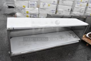 BRAND NEW SCRATCH AND DENT! Regency 600EBT2496 24" x 96" 16 Gauge Type 304 Stainless Steel Enclosed Base Table with Open Front and Adjustable Midshelf