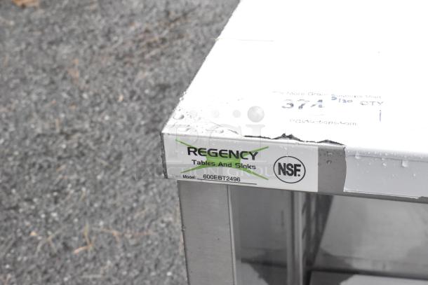 BRAND NEW SCRATCH AND DENT! Regency 600EBT2496 24" x 96" 16 Gauge Type 304 Stainless Steel Enclosed Base Table with Open Front and Adjustable Midshelf - Image 3 of 3