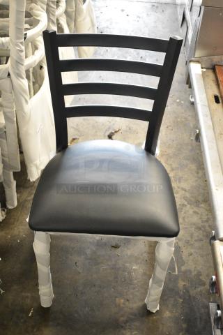 24 BRAND NEW SCRATCH AND DENT! Lancaster Table & Seating 164CMTLADFR Black Finish Ladder Back Chair with 2 1/2" Black Vinyl Padded Seat. 24 Times Your Bid!