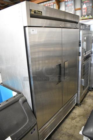 True T-49 Stainless Steel Commercial 2 Door Reach In Cooler on Commercial Casters. 115 Volts, 1 Phase.