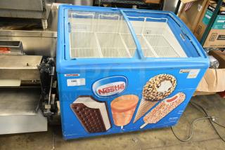 AHT RIO S 100 Metal Commercial Chest Freezer Merchandiser on Commercial Casters. See Pictures for Missing Glass Pane i Right Side Lid. 115 Volts, 1 Phase.