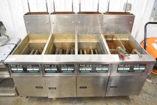 2017 Pitco Frialator SG14 Stainless Steel Commercial Natural Gas Powered 4 Bay Deep Fat Fryer w/ Filtration System and 3 Metal Baskets on Commercial Casters. 110,00 BTU.