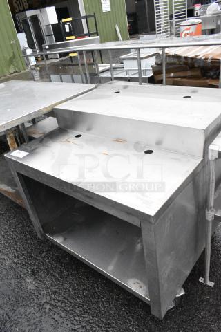 Stainless Steel Table w/ Under Shelf on Commercial Casters.