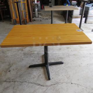 One Wooden Butcher Block Table Top On A Pedestal Base. 48X30X30