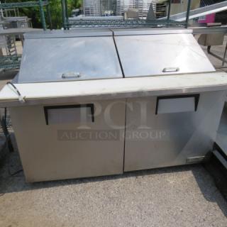 One WORKING True 2 Door Refrigerated Prep Table With 2 Racks, And A Cutting Board On Casters. Model# TSSU-60-24M-B-ST-HC. 115 Volt, 60X34X45. $5345.31 - Item #1188281