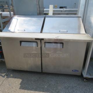 One WORKING Atosa 2 Door Refrigerated Prep Table With 2 Racks And A Cutting Board, On Casters. Model# MSF8307GR. 115 Volt. 60X37X45. $3469.00 - Item #1188290