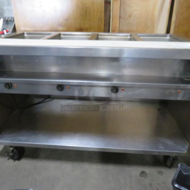 One Delfield 4 Well Electric Steam Table With A Cutting Board, And  SS Under Shelf On Casters. WORKING WHEN REMOVED,.  Model# EHE160C. 208-230 Volt. 1 Phase. Hardwired.  60X31.5X37. $5409.00 - Image 3 of 4