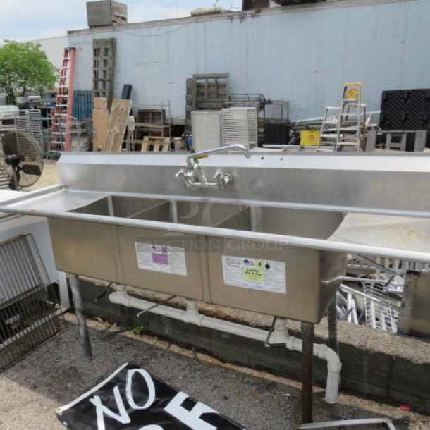 One Stainless Steel 3 Compartment Sink With Faucet And R/L Drain Board. 90X24X44 - Image 1 of 2