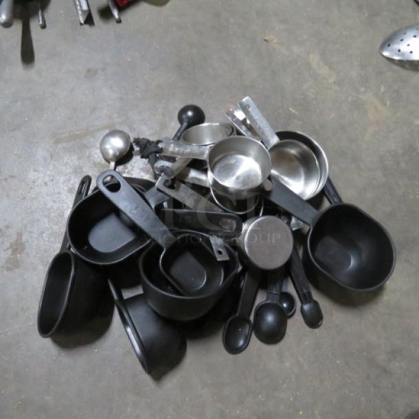 One Mega Lot Of Measuring Cups And Spoons. - Image 1 of 1