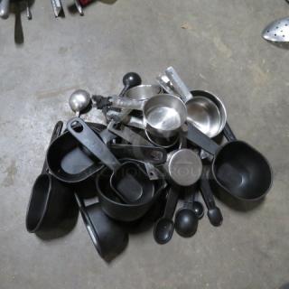 One Mega Lot Of Measuring Cups And Spoons.