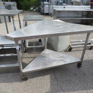 One Stainless Steel Corner Table With A Stainless Under Shelf On Casters. 56X32.5X36