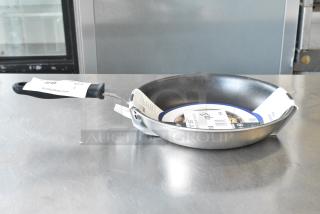 BRAND NEW SCRATCH AND DENT! 922692410 Vollrath Tribute 10" Tri-Ply Stainless Steel Non-Stick Fry Pan with CeramiGuard II Coating and Black Silicone Handle 692410