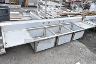 BRAND NEW SCRATCH AND DENT! Regency 600S32424224 124" 16-Gauge Stainless Steel Three Compartment Commercial Sink with 2 Drainboards - 24" x 24". No Legs.