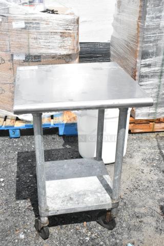Stainless Steel Table w/ Metal Under Shelf on Commercial Casters.