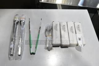 8 BRAND NEW SCRATCH AND DENT! Items Including 2 Vollrath 47113 12" Economy Stainless Steel Utility Tong, 4 267280001 Choice Delmont 6 1/8" 18/0 Stainless Steel Medium Weight Teaspoon - 12/Case,  Vollrath 4790970 Jacob's Pride® 9 1/2" Stainless Steel VersaGrip Tongs with Green Coated Kool-Touch® Handle. 8 Times Your Bid!