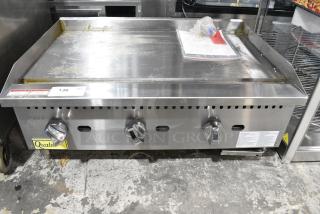Qualite GLEG-36/NG Stainless Steel Commercial Countertop Natural Gas Powered Flat Top Griddle. 90,000 BTU.