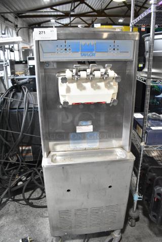 Taylor 336-27 Stainless Steel Commercial Floor Style 2 Flavor w/ Twist Soft Serve Ice Cream Machine on Commercial Casters. 208-230 Volts 1 Phase. - Item #1183889