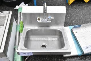 Stainless Steel Single Bay Wall Mount Sink w/ Faucet and Handles.