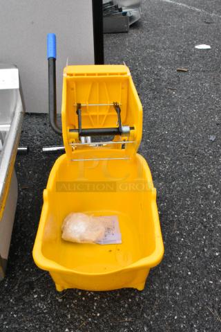 Lavex Yellow Poly Mop Bucket w/ Wringing Attachment on Commercial Casters.