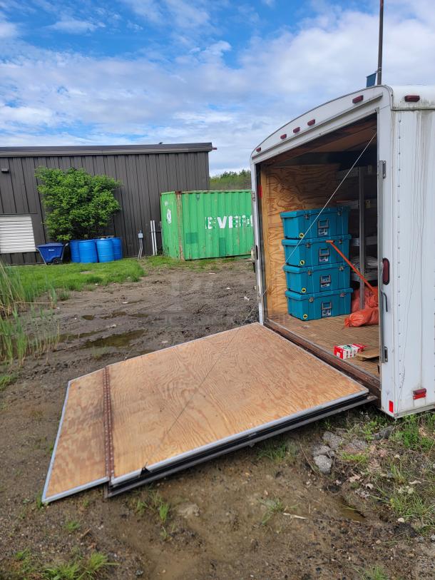24' Continental Cargo Enclosed Tandem Axle Trailer! Comes with spare tire.*CONTENTS NOT INCLUDED* Equipped with overhead lighting, wood paneling interior, shelving, and electrical outlets! - This item is off site in Biddeford. - Image 7 of 15
